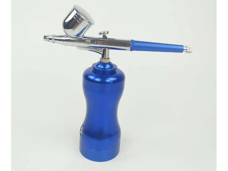 blue airbrush spray for beauty care 